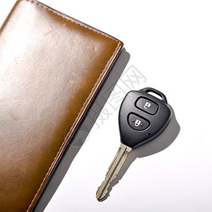 带有钱包的 car 键男人小路白色钥匙男性剪裁棕色电话控制皮革图片