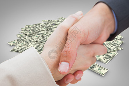 连结新搭档握手的复合图像 接近新的伴侣男人女士金融合伙商业问候办公室货币生意人财富图片