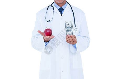 苹果和钱素材持有现金和红苹果的医生背景