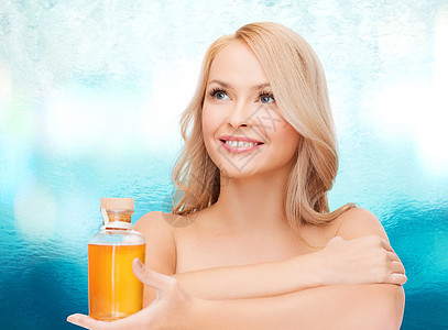 以油瓶为快乐的女子洗剂卫生身体皮肤女士疗法保健治疗女性芳香图片