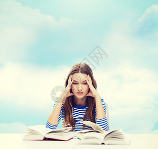 有书本的重力女学生学校会议蓝色女性图书页数头痛大学知识女士图片