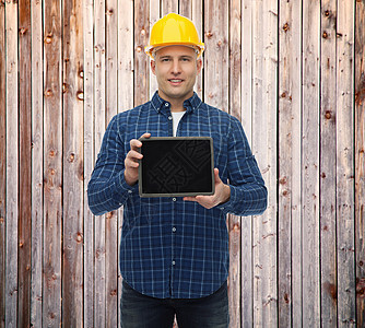 戴着平板电脑头盔戴头盔的男性微笑建筑工工作工具安全帽木头木匠工人广告男人建造工程师图片