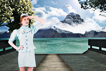 美丽的空姐的复合图像 仰望着天空树木快乐女性航空绘图制服计算机职业旅游蓝色图片