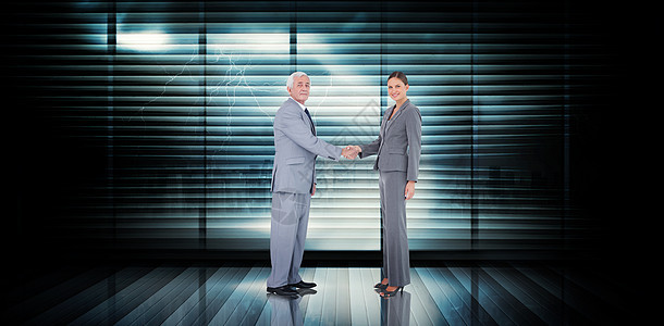 商业团队握手的复合形象窗户女士手臂延伸风暴景观阴影计算机同事商务图片