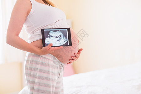 显示超声波扫描的孕妇孕妇装身体护理休闲女性腹部待产睡衣电脑女士图片