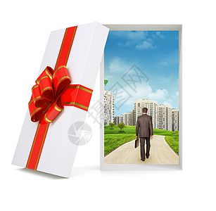 城市风景与行走的商务人士 在礼品盒图片