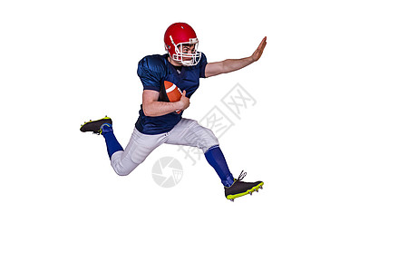 美国足球运动员与球一起跳过比赛蓝色体育运动服对手竞技一只手红色竞赛手臂跑步图片