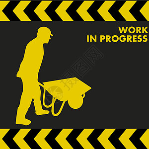 工作在进步标志上 工人携带手推车图片