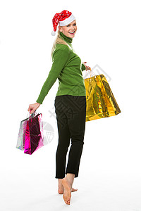 妇女为圣诞节买东西的妇女套餐绿色裤子购物黑色赤脚女士成人金发女郎毛衣图片