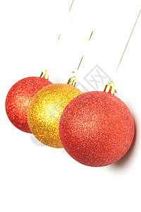 三个圣诞球季节派对假期乐趣红色装饰元素季节性金子丝带图片