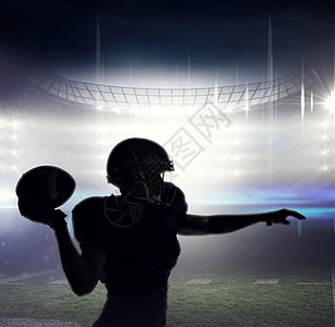 美国橄榄球运动员抛球的轮光图像合成图象Name聚光灯计算机混血运动服体育场团队沥青绘图世界绿色图片