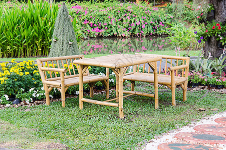 竹子椅子公园文化扶手椅热带植物棕色家具花园季节木头图片