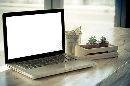 电脑放在桌上桌子技术商业办公室白色屏幕职场工作笔记本展示图片
