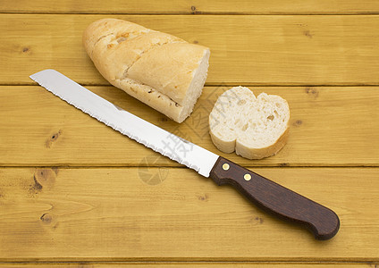 切片切开的百袋饼面包用具食物木头桌子工具小吃烹饪图片