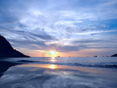 海上日落热带日出海浪海滩太阳假期天堂海岸冲浪海洋图片