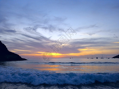 海上日落海岸海滩地平线热带太阳天空海洋天堂假期海浪图片