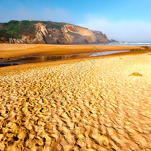 海滩岩石阴霾爬坡海岸线薄雾沙丘海景正方形海岸波浪图片