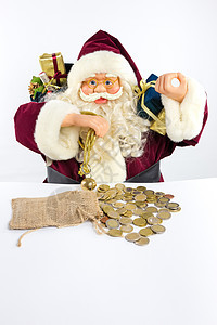 带礼物和钱币的圣诞老人经济愿望老年铃声胡须庆典钱袋子假期男人幽默图片