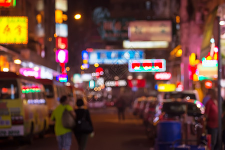 Jordan 鄰居在夜间城市移动的人们的模糊形象旅行交通照明人行道中心自行车穿越生活建筑街道图片