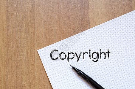 笔记本上的版权写作商业执照法律创造力机密安全侵权商标作者协议图片