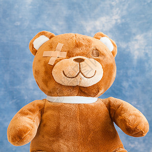 受伤的泰迪熊儿科疼痛援助病人蓝色悲伤保健保险玩具毛皮图片