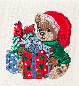 小棕熊 带圣诞帽子和礼物盒图片