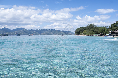 印度尼西亚热带节日印度尼西亚悬崖海景海岸线蓝色支撑假期风景太阳晴天冒险图片