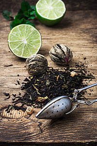 含石灰和木木本底薄荷的茶茶酿热带乡村草本植物焊接芳香食物花瓣产品药品水果图片