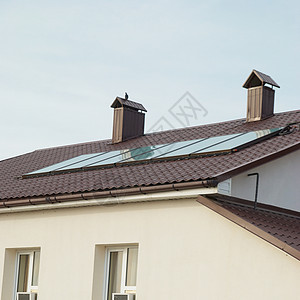 房顶上的太阳能电池板地质系统活力力量太阳电气技术环境房子生态收费集电极图片
