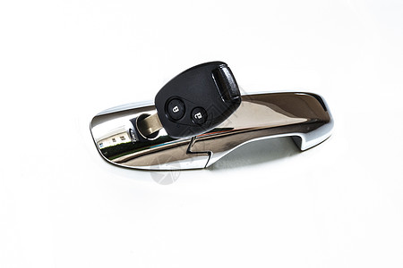 洞口的车钥匙汽车钥匙扣安全金属运输控制黑色按钮白色技术塑料图片
