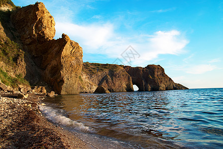 海海景观假期地平线岩石石头洞穴太阳日出热带海洋紫色图片