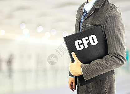 Bokeh背景中带有文档文件文件名 CFO 的 cFO 业务man图片