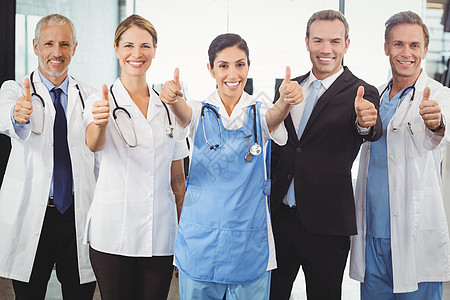 医疗队举起手来笑着笑着专家手势女士外科团队护士女性服务快乐医师图片