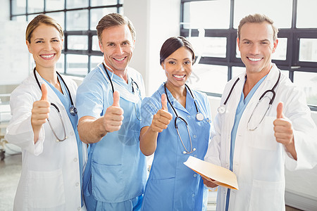 医疗队举起手来笑着笑着工人医护人员外科医生快乐女性专家诊所手势团体图片