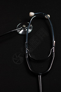 黑色背景的脉动镜反射测量金属乐器合金疾病临床考试器具诊断橡皮图片