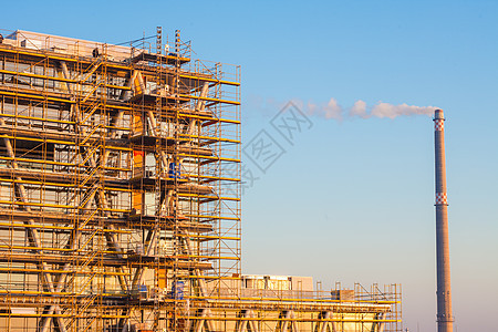 建筑工地工程技术晴天橙子项目黄色工作阳光天空日落图片