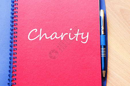 慈善在笔记本上写作家庭社区羊皮纸机构乡村杯状贫困照顾者权利祝福图片
