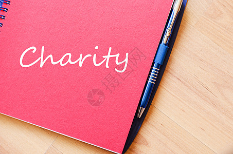 慈善在笔记本上写作机构照顾者乡村权利祝福社区贫困家庭杯状羊皮纸图片