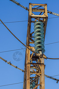 电线上的电绝热器蓝色电压发电机工程玻璃建筑学通讯危险植物接线图片