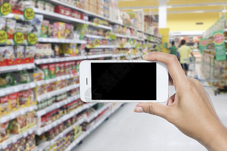 手握移动消费者顾客杂货店市场购物中心电话销售食物产品零售图片