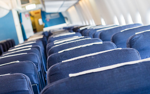 客舱的空旧飞机座椅 有选择性地集中空气运输旅行航空公司椅子黑色座位蓝色经济航班图片