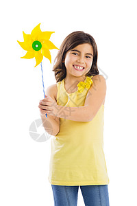 黄色风车玩风车玩具喜悦孩子们儿童黄色白色女性乐趣幸福风车背景