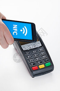 在接近外地通信技术的地方与NFC公司支付移动费用贸易信用交换场地店铺芯片银行业现金活动海浪图片