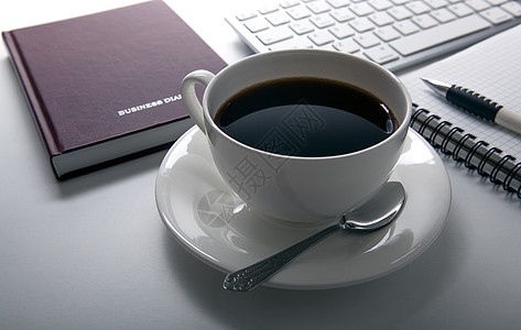 工作场所的咖啡早餐会办公室静物笔记本记事本杯子台面日记外表时光床单图片