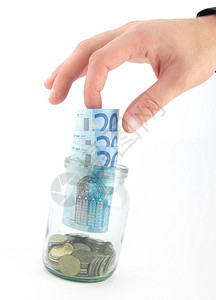 手拿欧元硬币经济玻璃白色尖端财富储蓄瓶子绿色货币图片