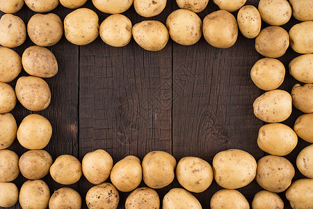 生锈木制背景的土豆植物蔬菜块茎食物糖类饮食团体收成场地麻布图片