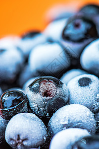 在一个碗里冰冻的阿罗诺尼亚浆果健康饮食营养食物宏观黑果黑色苦莓水果图片