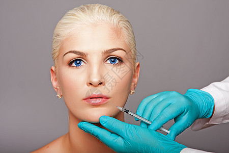 注射美学面容的化妆型整容外科外科医生胶原化妆品美容师眼睛塑料护理手套蓝色治疗女性图片