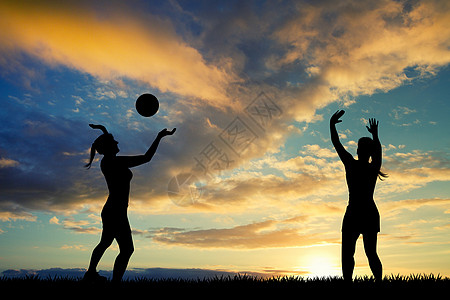 踢足球女孩日落时女孩玩排球背景