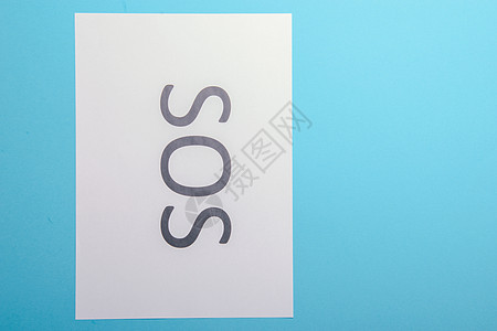 Word SOS 写在纸上领带帮助男性商务危险事故援助人士男人情况图片